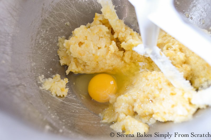 Whole Eggs being added to creamed sugar mixture for Lemon Poppy Seed Bread.