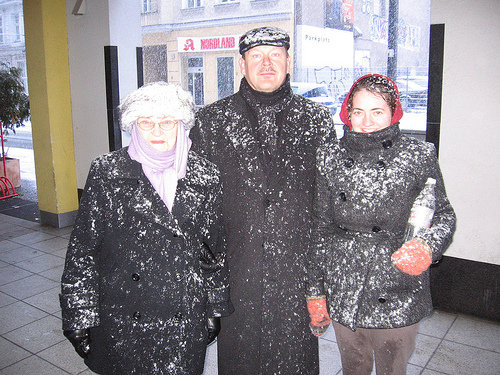 family covered in snow