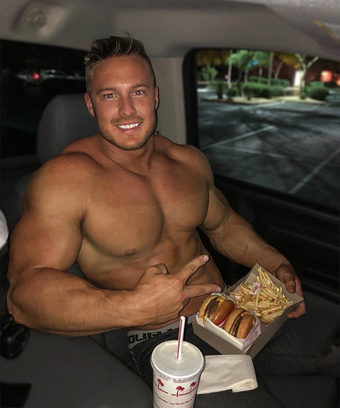 cute-bare-chest-muscle-blond-daddy-beefcake-eating-fast-food-car-smiling