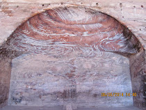 The rich carved rock ceiling swirl of temple chambers, Petra, Jordan