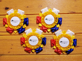 Four pieces of rosette centerpiece with Filipino flag color scheme Four pieces of rosette centerpiece with Filipino flag color scheme (red, blue, white and yellow)