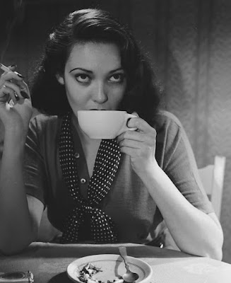 Linda Darnell drinking coffee and smoking
