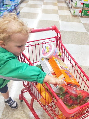 kid with groceries