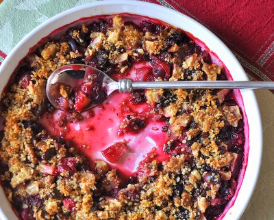 Cranberry Apple Crisp ♥ KitchenParade.com, my signature dessert during cold weather. A classic sweet apple crisp, punched up cranberries and brandy-soaked currants, bright with citrus and ginger.