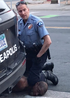 Minneapolis police officer Derek Chauvin kneeling on the neck of George Floyd, killing him, May 25, 2020