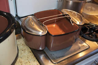 Three nesting containers for cooking separate items in vintage Nesco Roastmaster electric roaster