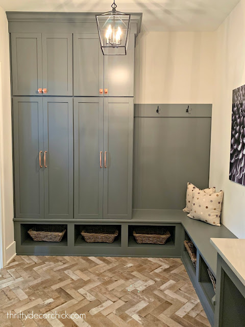 Gray cabinets brick floor mud room