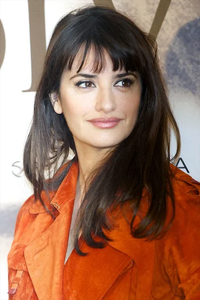 Penelope Cruz selected a rust suede trench coat from the Loewe Spring 2012 collection which she wore with dark wash jeans