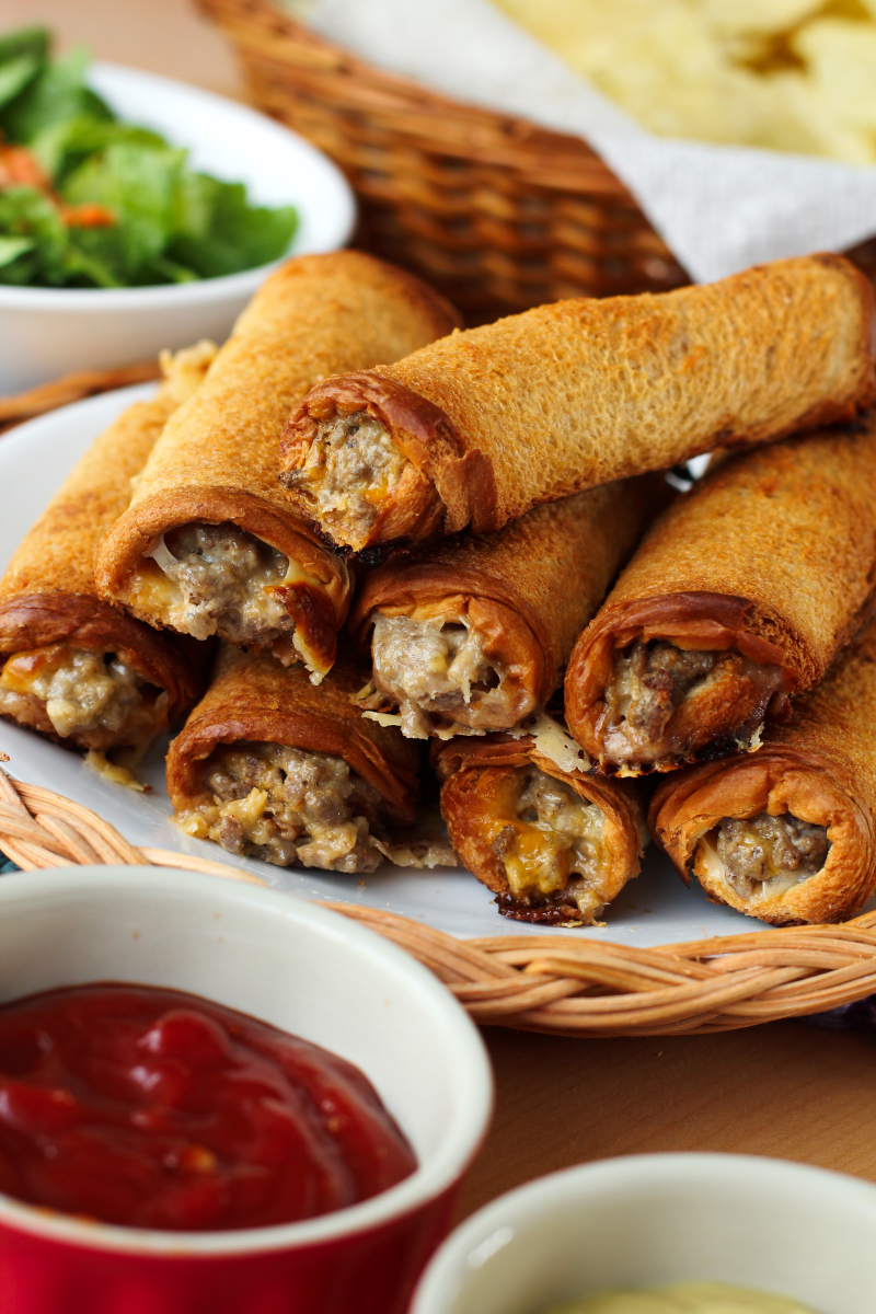 Cheeseburger Roll-Ups put a fun spin on burger night. They will make the whole family happy with their crisp, buttery outside and delicious cheeseburger filling! #groundbeefrecipes #easydinner