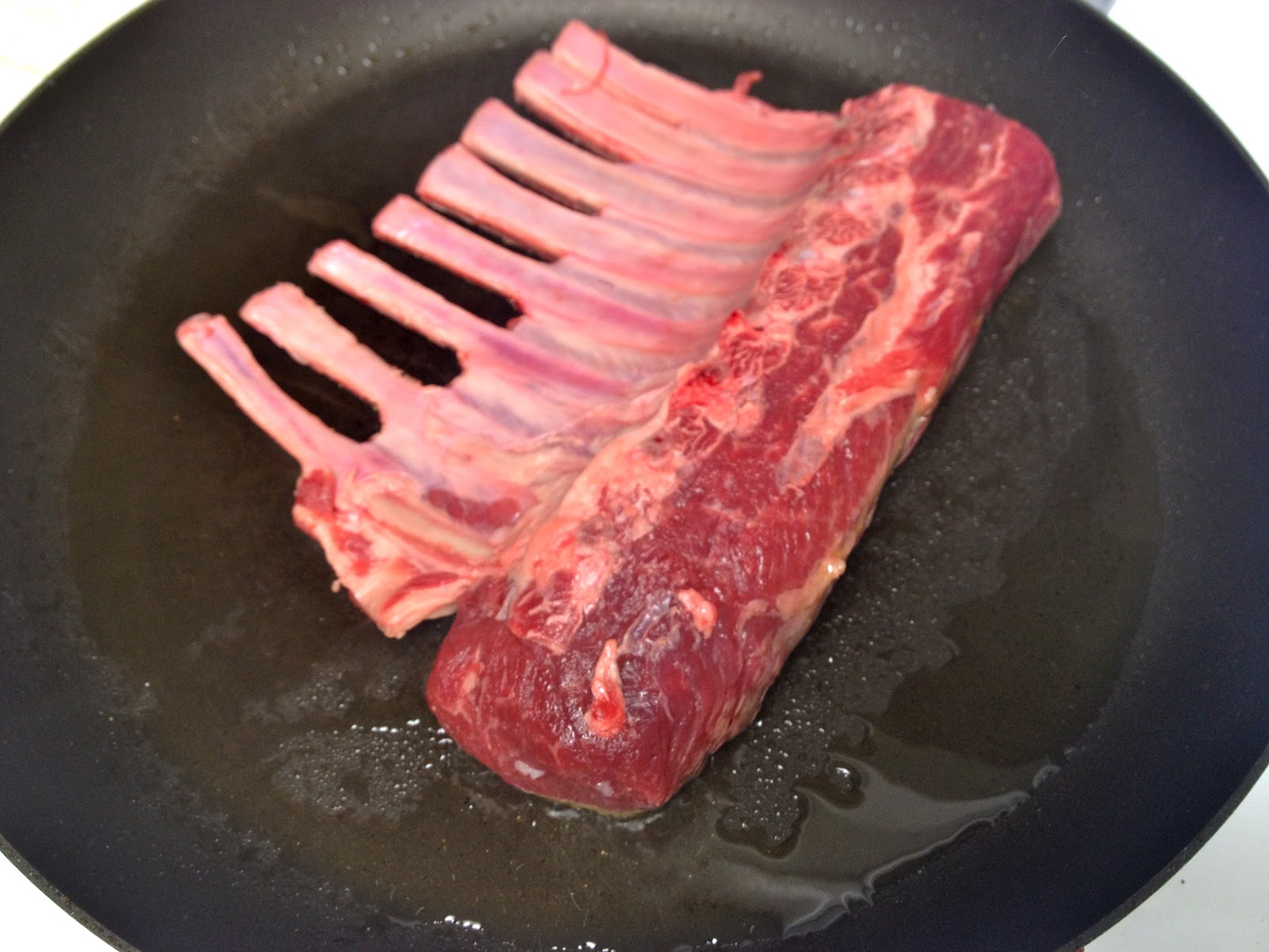 PanSeared OvenFinished Salt and Pepper Rack of Lamb with Crispy