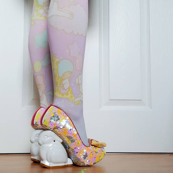 wearing sequins court shoe with pastel printed tights and rabbit shaped heels
