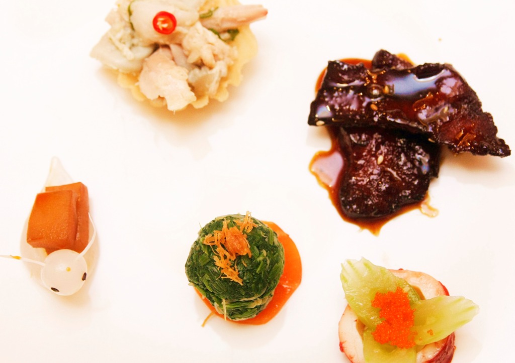 Stewed Snail with Garlic and Chili Sauce, Spinach with Green Mustard, Marinated Cuttlefish and Japanese Bean Curd, Marinated Chicken and Sliced Abalone with Wasabi, and Deep-Fried Fish with Five Spices. 