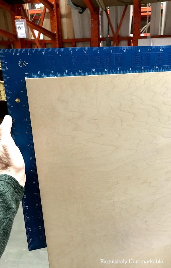 Making Sure Plywood Is Square with a metal square