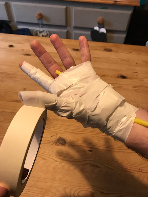 step by step masking tape mummy hand DIY Halloween crafts
