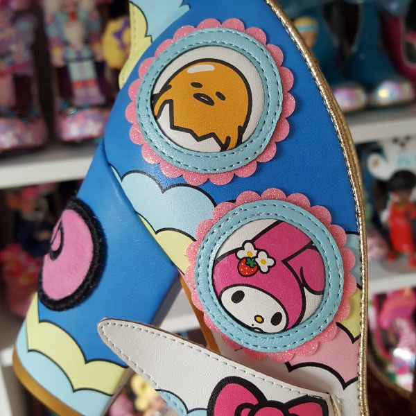 close up of My melody and Gudetama characters in round window applique on side of shoe