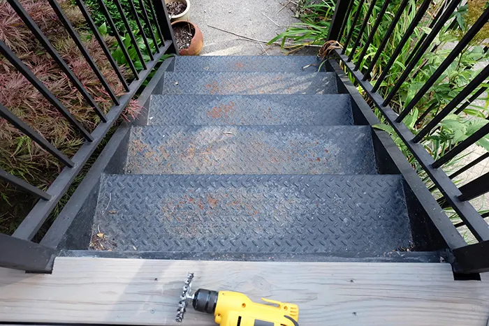rusting metal stair steps before