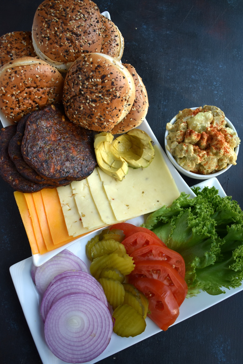 Vegetarian Burger Bar has all your favorite burger toppings including tomato, lettuce, onion, pickles, cheese, avocado, veggie burgers and more for easy entertaining that everyone will love! www.nutritionistreviews.com