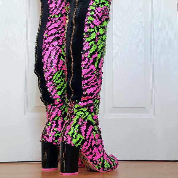 back of legs wearing zip up thigh length boots in hot pink sequins