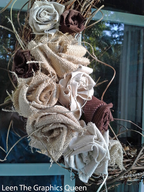 This gorgeous rustic wreath is made with burlap flowers and twigs