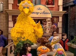 Baby bear, Goldielocks, Big Bird and Zoe appear in front of the Furry Arms Hotel. Sesame Street Do the Alphabet