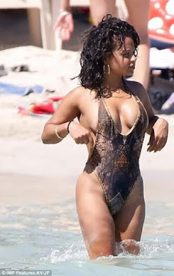 0 Christina Milian suffers nipple slip at the beach...with the swimsuit she wore, it was inevitable (photos)