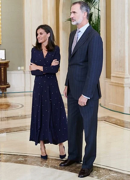 Queen Letizia wore a new asymmetric midi dress by Maje. We saw the same dress on Argentina's First Lady Juliana Awada