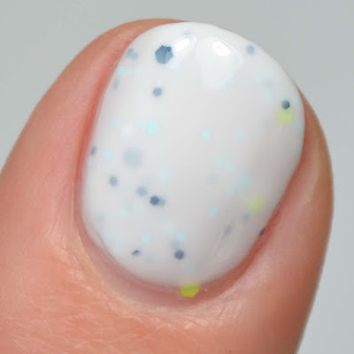 white crelly nail polish with assorted glitter swatch