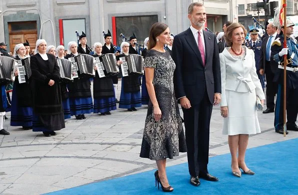 King Felipe and Queen Sofia at Princess of Asturias Awards 2018 ceremony. Queen Letizia wore Felipe Varela dress and Magrit pumps