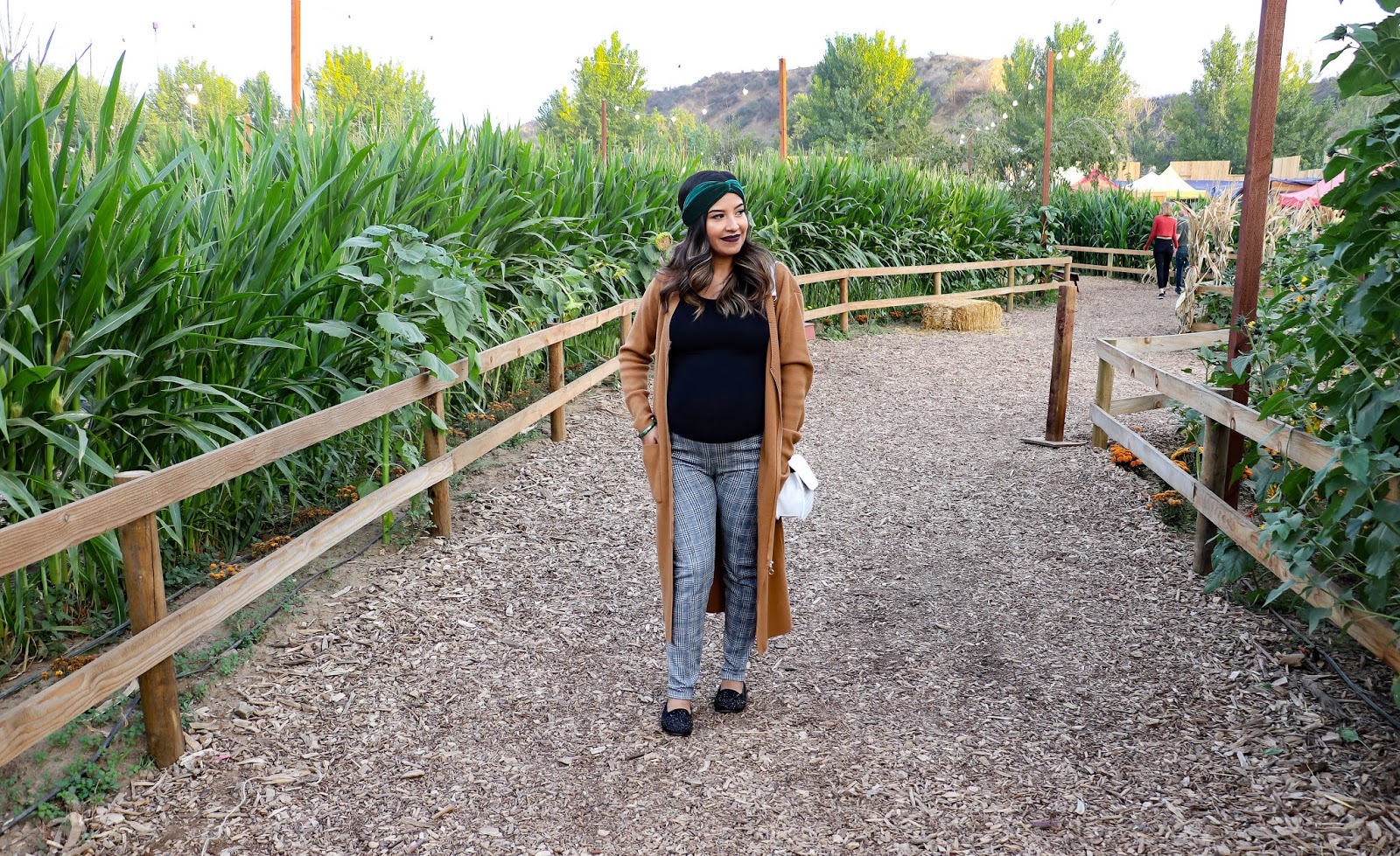 Fall Pumpking patch outfit with long camel cardigan and plaid leggings