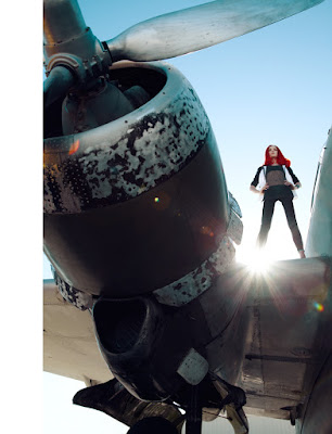 airplane fashion shoot, woman standing on airplane, german madame, airport