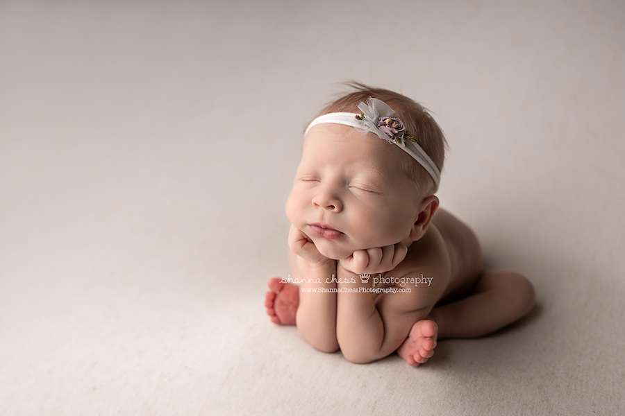 Newborn girl in froggy pose, best Oregon newborn photographers