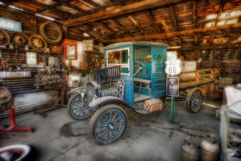 A general store on Route 66 featuring "a little Ford" [LAST]