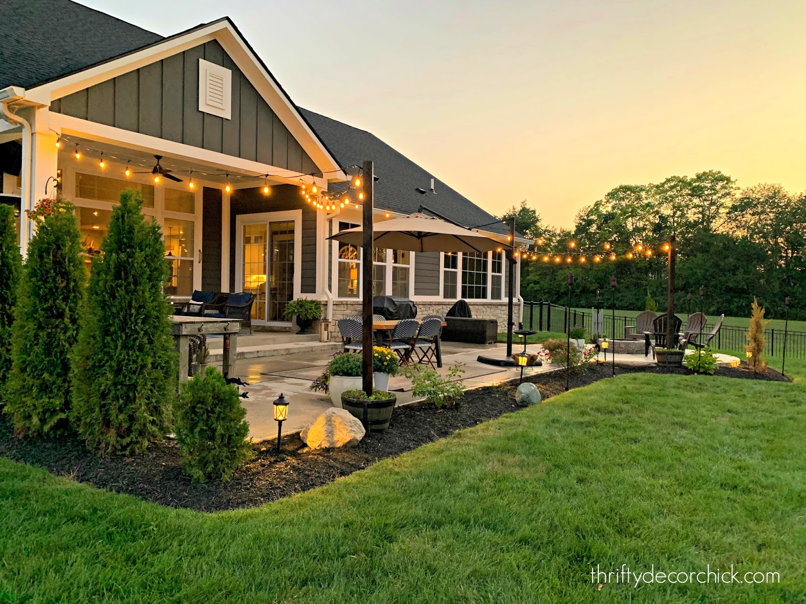 Patio with DIY outdoor lights in planters