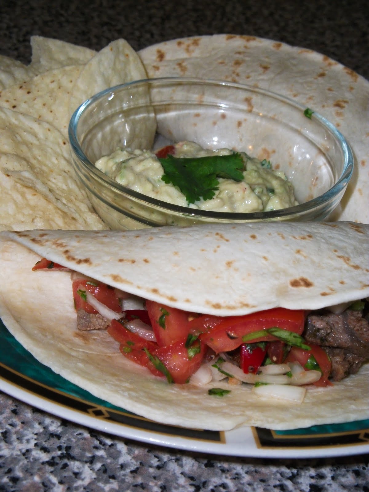 Searing Flame Traditional carne asada with pico de gallo and sour cream avocado sauce