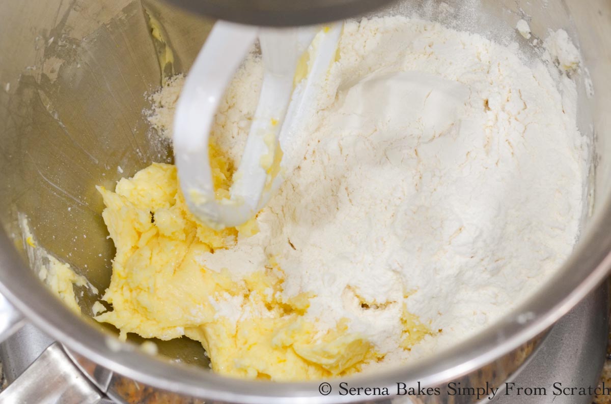 All-Purpose Flour being added to creamed butter mixture.