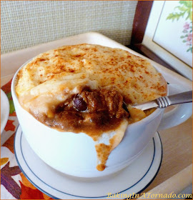 Chili Beef Pot Pie, a potato crusted pot pie full of beef, beans and corn cooked chili style. A hearty winter dish | Recipe developed by www.BakingInATornado.com | #dinner #beef