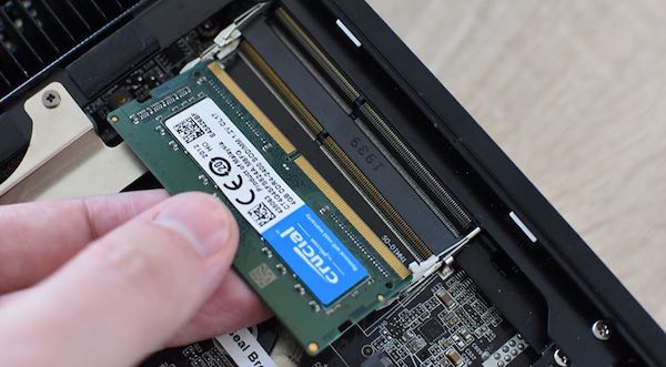 Properly inserting the RAM unit onto the available slot
