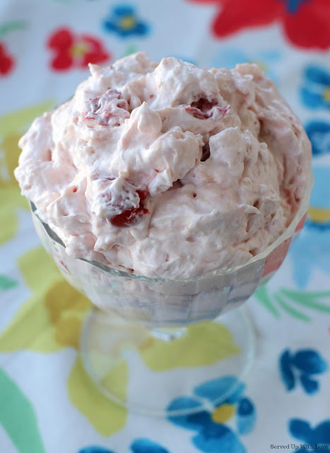 Glass bowl with cherry flavored pudding with marshmallows and pineapple