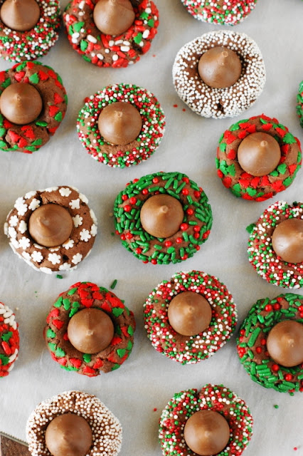 Christmas Chocolate Kiss Cookies ~ Spread some holiday cheer with these adorable little treats! A fun cookie project for kids & grown-ups alike.  www.thekitchenismyplayground.com