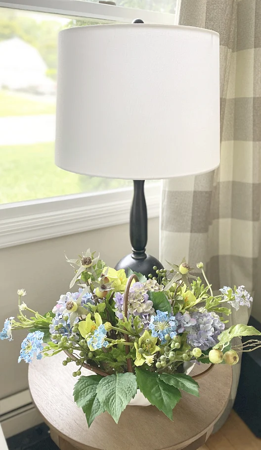 lamp and end table with hydrangea centerpiece