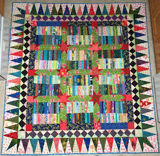 Chinese Coins quilt variation with wide sashing, star posts and scrappy borders