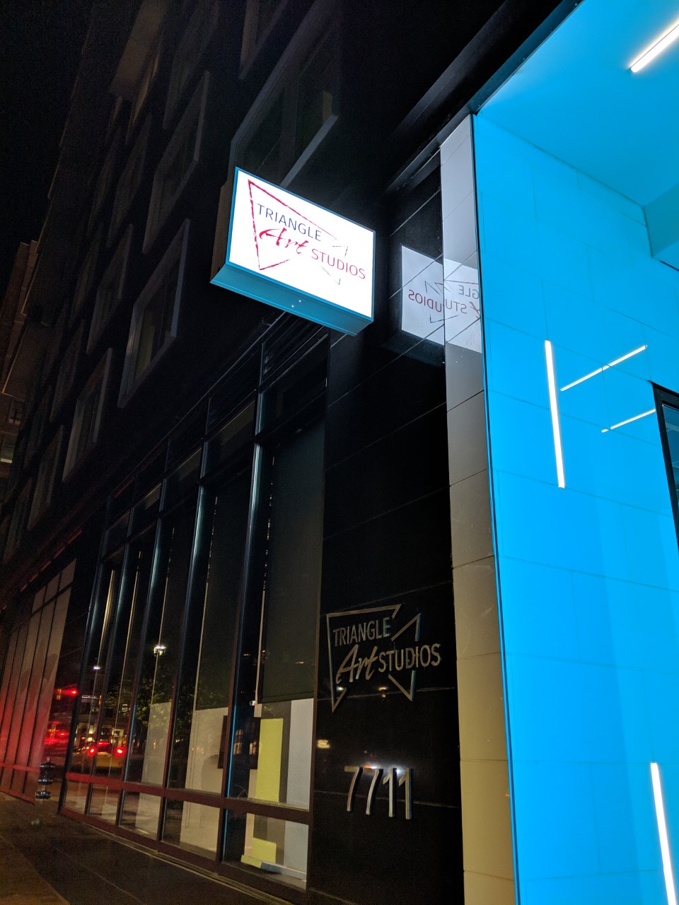 Robert Dyer Bethesda Row Sign lit at Triangle Art Studios