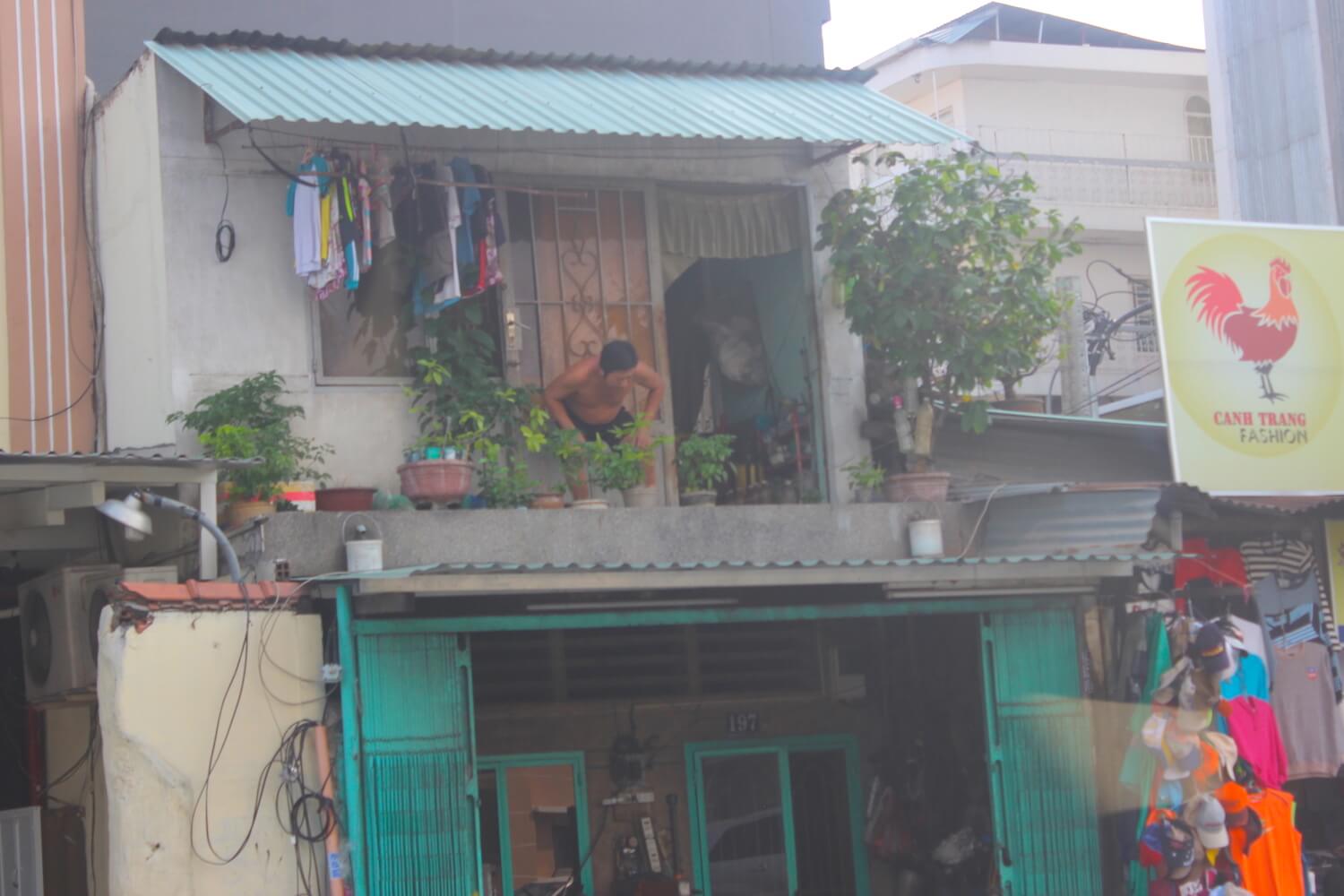 naked man on balcony ho chi minh city