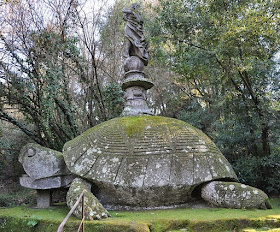 A giant turtle carrying a statue of a woman - one of the  bizarre sculptures in the Gardens of Bomarzo