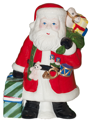 A big ceramic cookie jar shaped like Santa Clause carrying a large Christmas gift in one hand, and a sack of toys in the other hand.