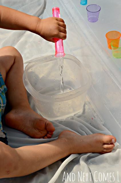 Toddler pouring water