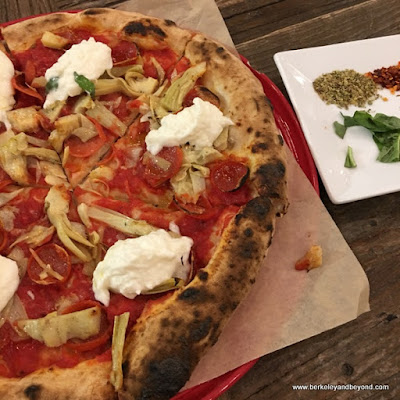 burrata pizza with garnish plate at Rise Pizzeria in Burlingame, California