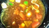 Capsicum onion red yellow bell peppers in soya chilli gravy