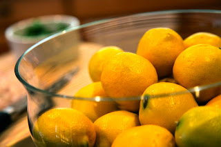 Large bowl of lemons are ingredients to prepare Lemon Risotto