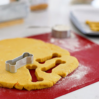 Making homeamde dog treats with bone shaped cookie cutter